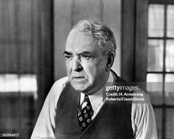 1930s 1940s ELDERLY BUSINESS MAN VEST TIE CHARACTER WORRIED SERIOUS FACIAL EXPRESSION GRUMPY MEAN ANGRY