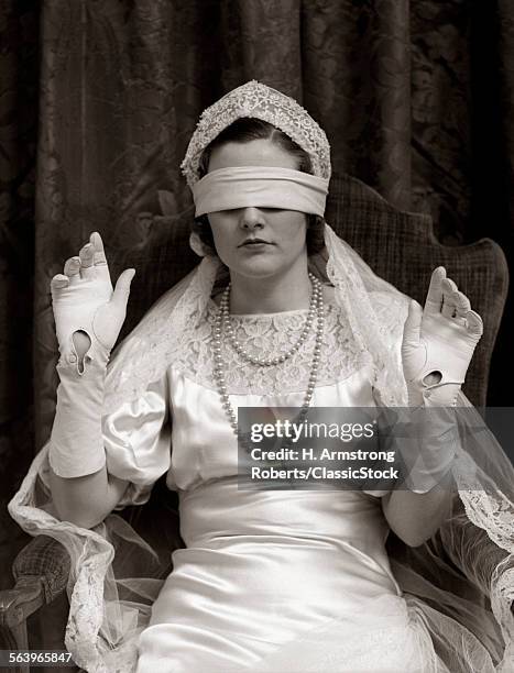 1930s BRIDE WEARING BLINDFOLD