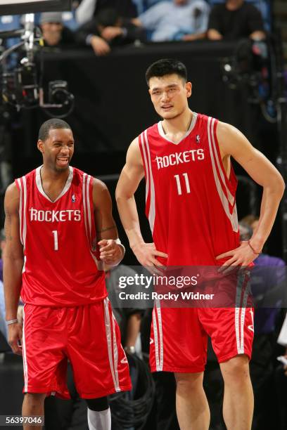 Tracy McGrady and Yao Ming of the Houston Rockets stand together during the game against the Sacramento Kings on December 8, 2005 at the ARCO Arena...