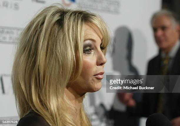 Actress Heather Locklear arrives at the L'Oreal Paris Presents "As Seen in... Harper's Bazaar" at the Lindbrook Gallery on December 8, 2005 in Los...