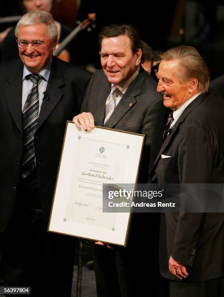 Former German Chancellor Gerhard Schroeder receives the DFB honorary membership from Dr.Theo Zwanziger , the DFB's executive vice president and...