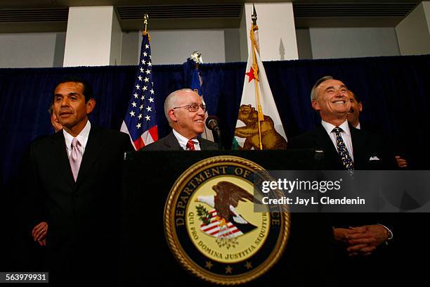 Attorney General Michael B. Mukasey, center, joined L.A. Mayor Antonio R. Villaraigosa, left, and L.A. Police Chief Wiliam J. Bratton in announcing...