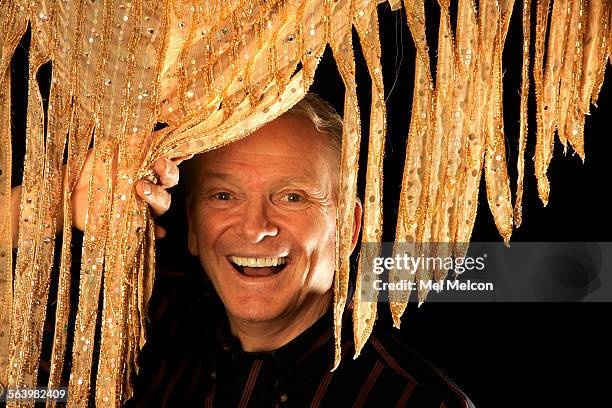 Fashion designer Bob Mackie stands behind print silk crepe de chine, at his design studio in Studio City on May 9, 2008. Mackie designed the costumes...