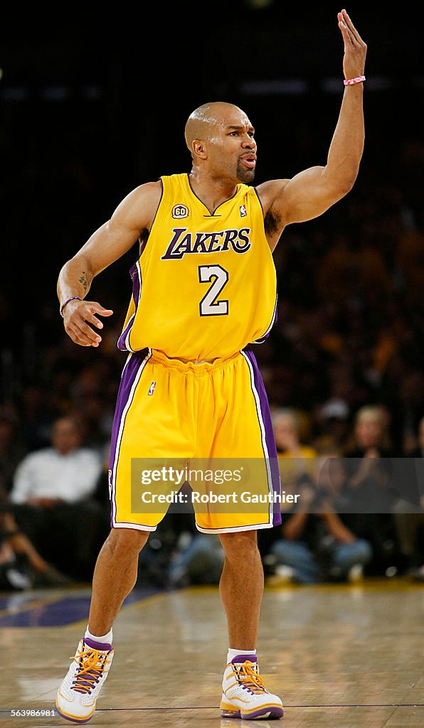 Lakers guard Derek Fisher disputes an official's call in the second half against the Utah Jazz in g