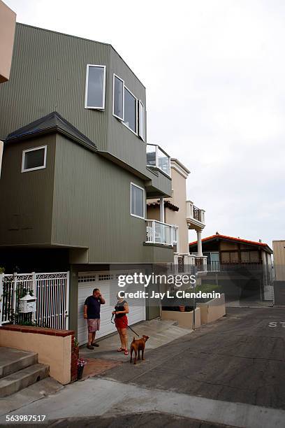 John and Rose Osten get ready to walk with their dog Ruby one block from their home to the sand of Manhattan Beach, May 6, 2008. The Ostens took...