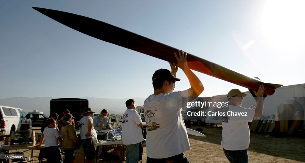 Hundreds turn out to the biannual model rocket competition in Lucerne Valley's dry lake during a t