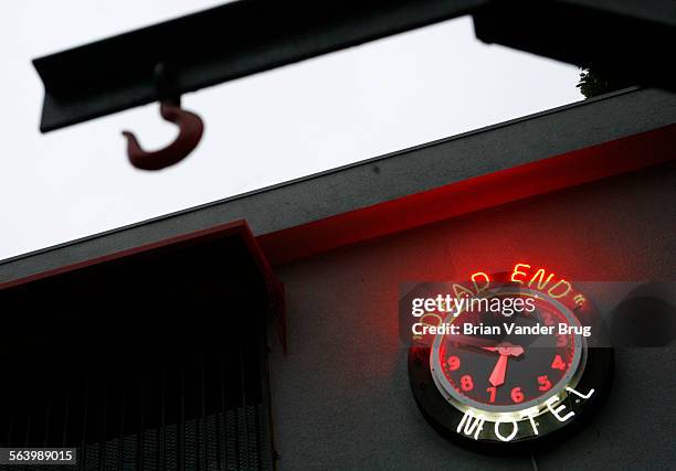 Neon clock on the side of the 1800AUTOPSY building with the words "Dead End Motel" lit up is the only clue as to what goes on inside the private...