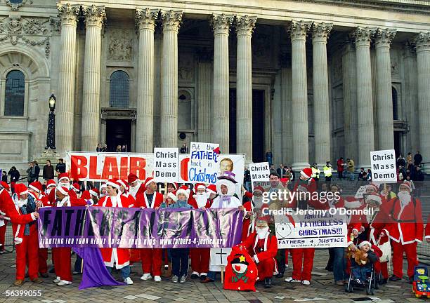 Protesters gather outside St Paul's Cathedral after a Fathers 4 Justice christmas campaign march, from the Church of England headquaters in...