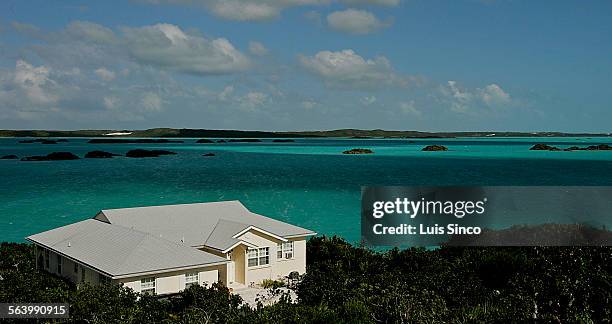 The sun and clouds create a changing palette of blues on the shallow waters of Chalk Sound in Providenciales, Turks and Caicos Islands.