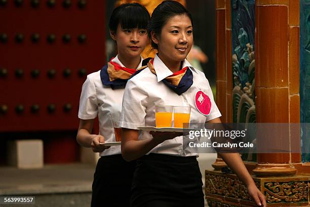 Two young women compete for the chance to be airline attendents for China Southern airline. China Southern airlines, China's largest carrier, is...