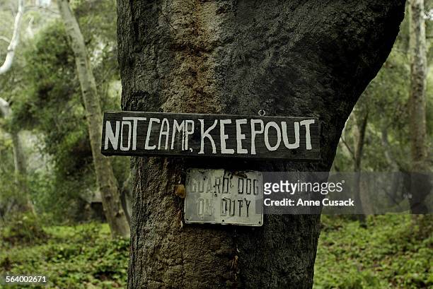 Sign on a oak tree on the Kronsberg property. Jeremy Joe Kronsberg and his wife Lynne Kronsberg live in this stone cabin with their dog Chagall. He...