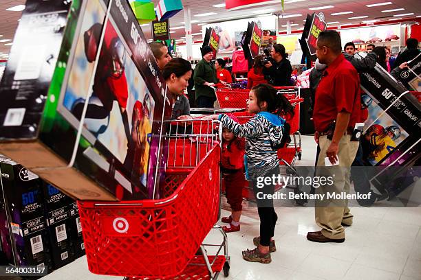 Black Friday shoppers flooded through the doors at a Target in Burbank looking for deals and sales. The store opened for Black Friday sales at nine...