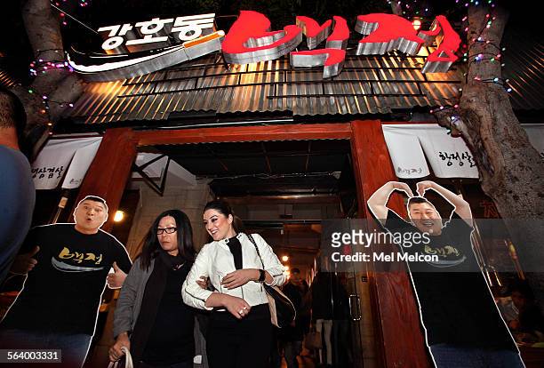 Cardboard cutouts of Kang Ho Dong, a wrestler turned comedian, are located in the front entrance to the Korean BBQ restaruant he owns, Kang Ho Dong...