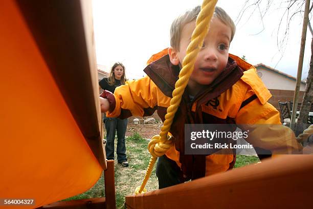 Tucson, Az.  Elena Zurheide watches her oneyearold son Robbie play in a friend's back yard in Tucson, Az. Zurheide's husband was killed in Iraq...