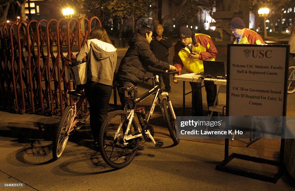 Guards checking students' ID at an entry point to USC campus on Jefferson Blvd. on Jan. 14, 2013. N