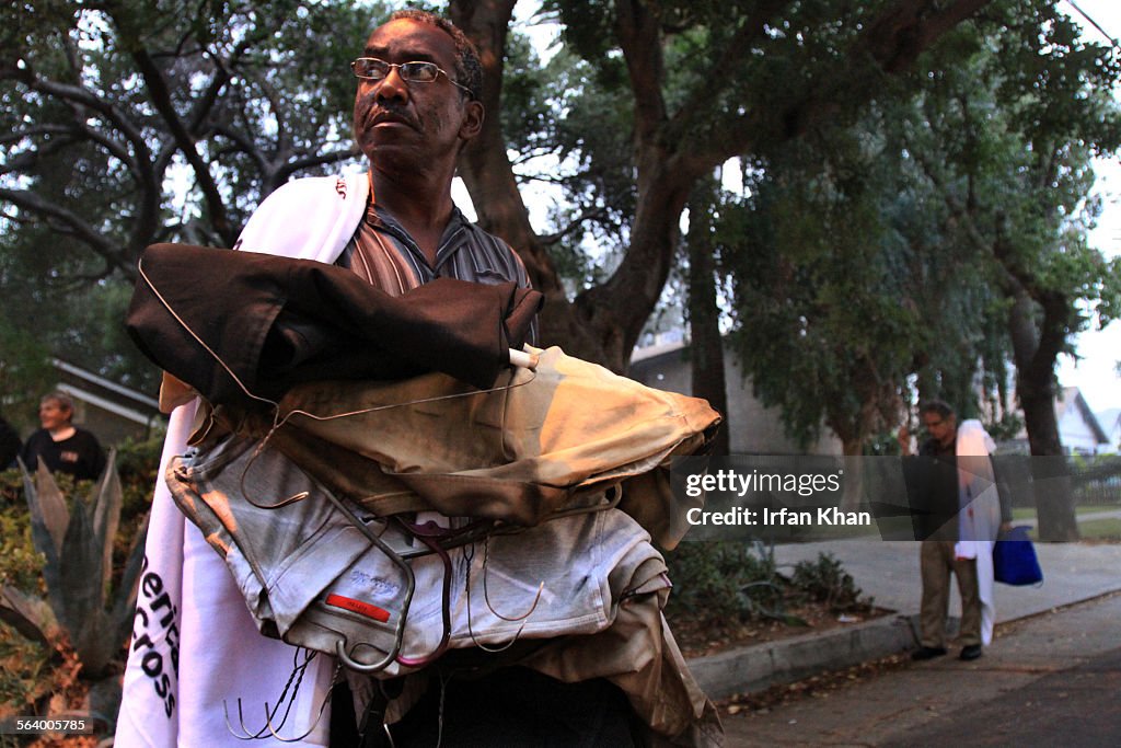 Displaced by fatal fire Rick Kindred, 56, who lived on the ground floor, holds onto his belonging a
