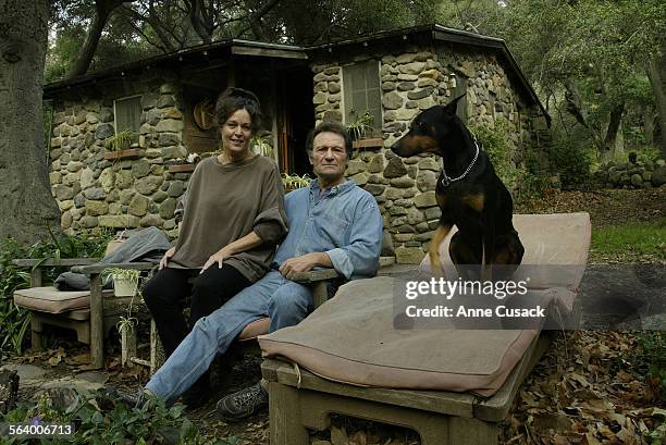 Jeremy Joe Kronsberg and his wife Lynne Kronsberg live in this stone cabin with their dog Chagall. He bought it in1979. They are being sued by their...