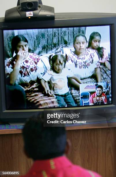 Mariano Gonzalez talks with his family in Quetzaltenango, Guatemala during a video conference from Amingo Latino in Los Angeles, Sunday....