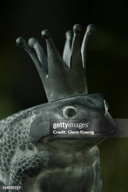 Frog Prince's crown holds a votive candle, from Restoration Hardware . This for a story about metal garden ornaments