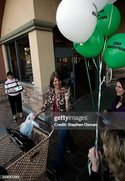 Brooke Luke of Moorpark, with cart, thanks detractors of Measure A6 for their efforts after giving them a cash donation. On far left is Susan Nardi...