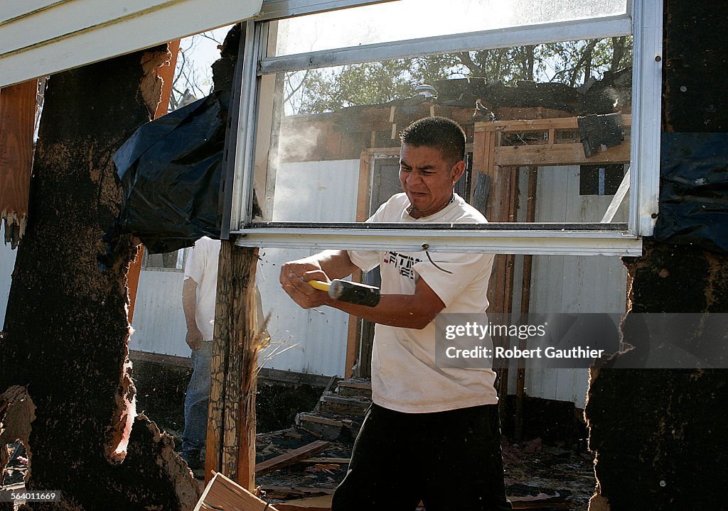 Juan Cogco helps demolish a building for Pastor Jesus Gonzales in Kenner, Louisiana, Sunday, Februa