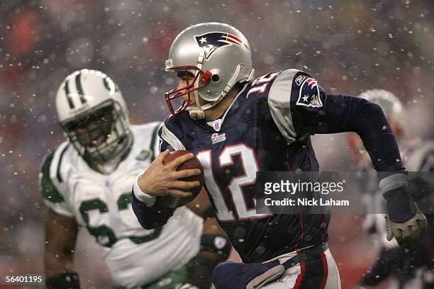 Quarterback Tom Brady of the New England Patriots runs with the ball during the game against the New York Jets at Gillette Stadium on December 4,...