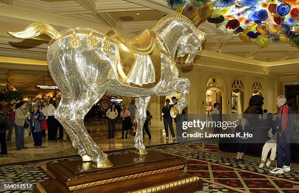 Four times a year The Bellagio Hotel Casino changes it's scene/theme in the Conservatory of the hotel. Pic. Shows the mirror glass mosaic horse in...