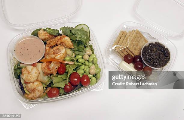 Lunch shrimp salad with edamame chick peas and grape tomatoes. Am snack  string cheese, grapes, crackers and tapenade.