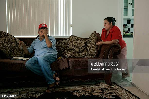 Soledad Aviles 54, left, and wife Guadulupe Torres De Aviles shown on the couch where they sleep, are losing their family dream home, a threebedroom...