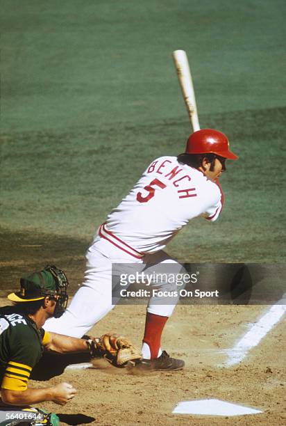 Cincinnati Reds' catcher Johnny Bench connects with the ball and starts to run for first during the World Series against the Oakland Athletics at...