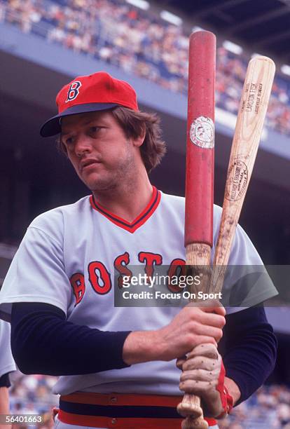 Boston Red Sox' catcher Carlton Fisk chews his tobacco and practices his swing during a game against the New York Yankees at Yankee Stadium circa the...