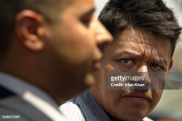 Agony and distress all over his face Jose Gonzalez father of missing boy David Gonzalez , right, listens as San Bernardino County Sheriff Deputy...