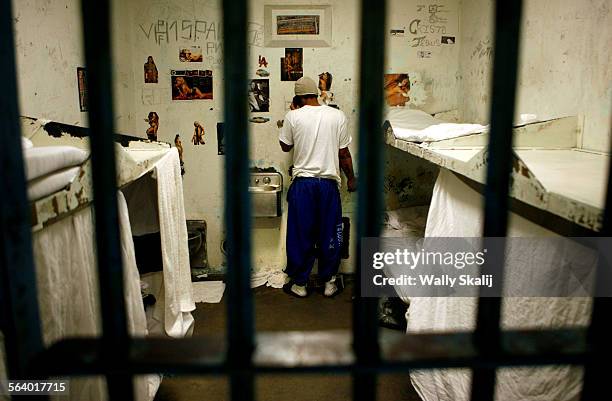 An inmate talks on the phone at the L.A. County Men's Central Jail in Downtown Los Angeles.