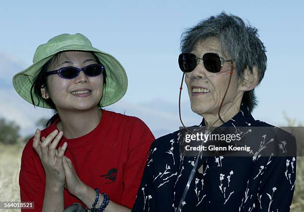 Left to right, Juliet Wong applauds Sue Kunitomi Embrey , as Sue received an award for her efforts in preserving Manzanar. Sue was detained at the...