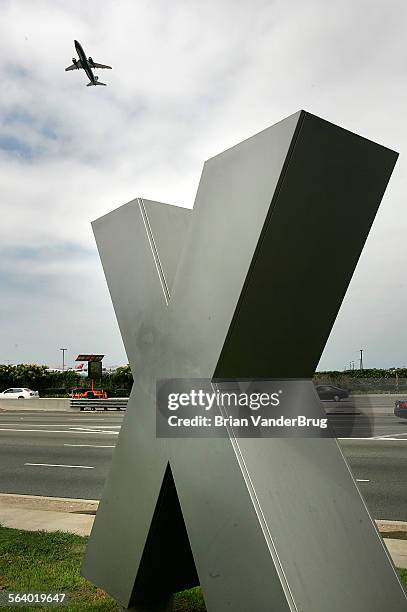 Aircraft takes off to the east over the city after LAX officials reversed air traffic as workaround to solve an instrument landing system failure...