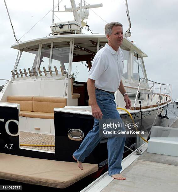 May 27, 2006. Brad Buettner, walks off his boat at his home in Huntington Beach. Brad had hip replacement surgery 3 weeks ago and is recuperating.