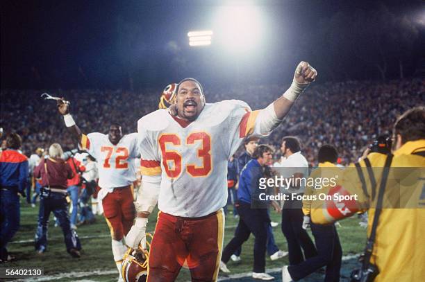 Washington Redskins Vernon Dean and teammate Dexter Manley gesture to the crowd during Super Bowl XVII against the Miami Dolphins at the Rose Bowl on...