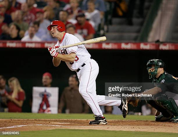 The Angels' Robb Quinlan homers to left field in the fourth inning against the Athletics at Angel Stadium in Anaheim on Thursday, September 1, 2005.