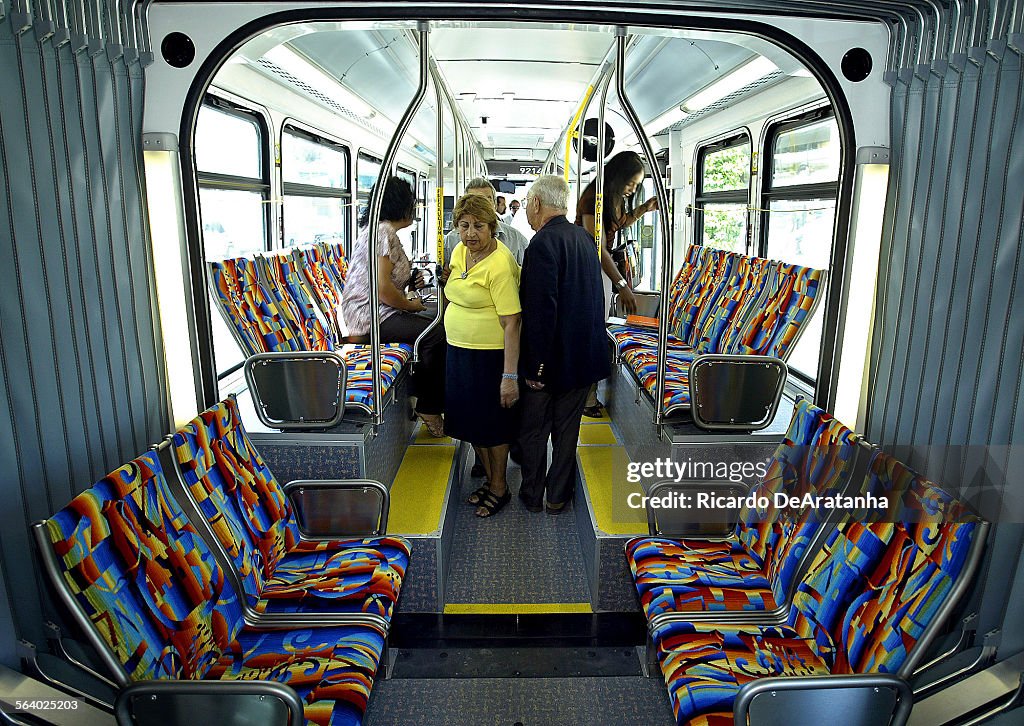 Bus Rider Line Potential bus riders walking through the new Metro Liner, the latest ...