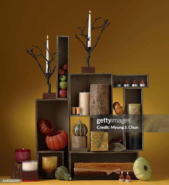 New candles and candle holders incorporate motifs from autumn/nature  pumpkins, fall apples, bare tree branches, etc. Photo shot on Friday,...