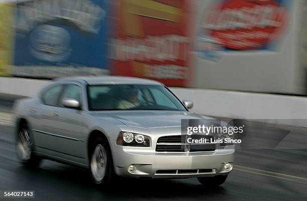 The new Dodge Charger R/T jumps off the starting line of the Irwindale Speedway. Photo taken 6/16/05.