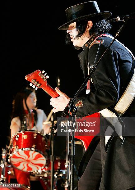 Jack White on guitar and Meg White on drums perform Monday, Aug. 15 at the Greek Theatre in Los Angeles. The minimalist rock duo called the White...