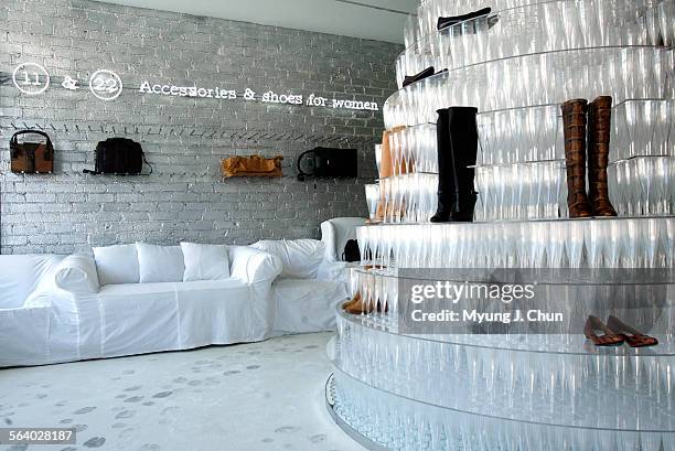 Visitors to Martin Margiela's new boutique in Beverly Hills are greeted by a champagne pyramid made of 6,200 glasses. The white, onepiece cover...