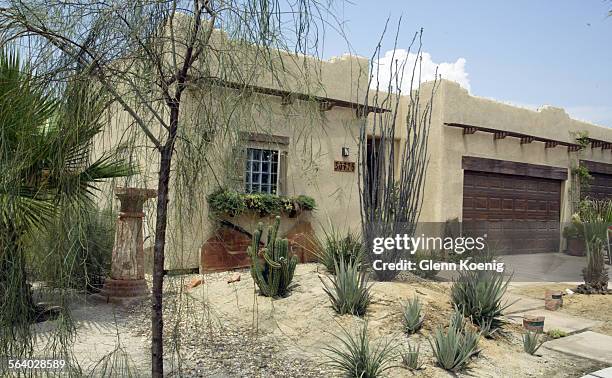 This Santa Fe Adobe is located on Osceola Place and features a desert landscape . This photo is for the weekly real estate column Neighborly Advice...