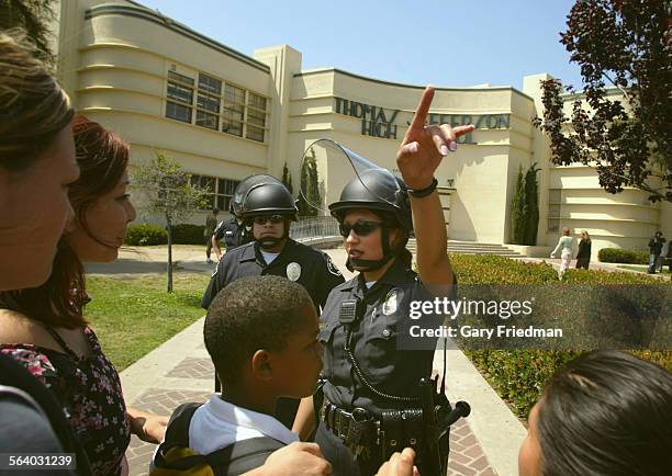 Officers direct parents and students after violence broke out again on Thursday, 5/26/05 at Jefferson High School in SouthLos Angeles. Two males...