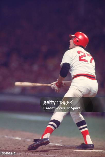 Hall of Fame member Carlton Fisk of the Boston Red Sox hits a home run off the foul pole in the 12th inning of game six against the Cincinnati Reds...