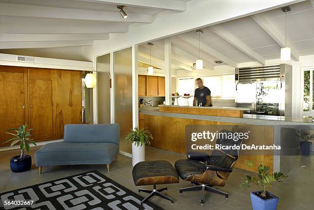 Home of Kevin Cwayna cq, that is a showcase of plywood. This openspace living/kitcen area features vintage 1950s plywood, new architectural features...