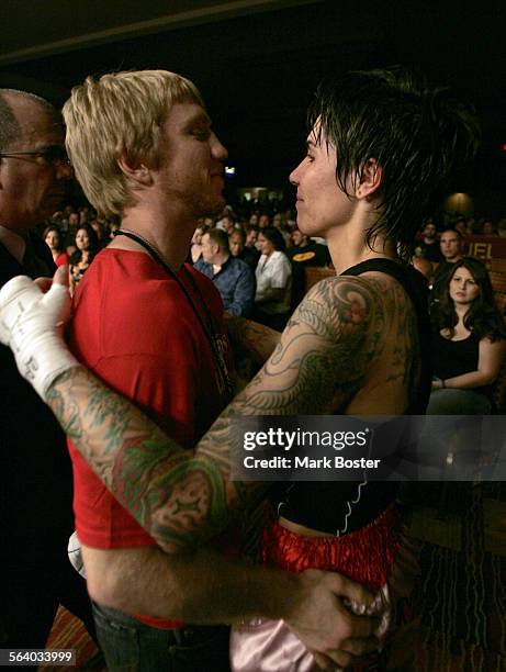 Roxy "Balboa" Richardson and her boyfriend Toby "Tiger Heart"Grear embrace after Roxy loses her Muay Thai bout against opponent Christina Martin at...