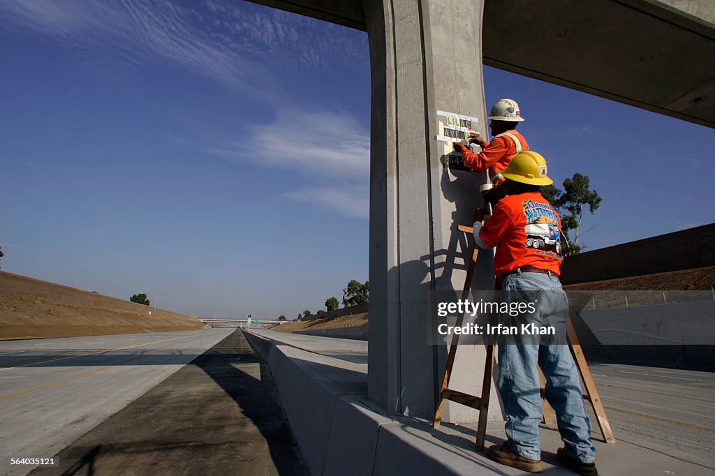 Rialto, July 24, 2007    Fred Estrada (Cq), 50, left, and Luis Lopez (Cq), 50, are printing Lila