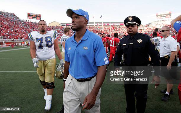 Coach Karl Dorrell leaves the field after losing to Utah 446 at RiceEccles Stadium in Utah Saturday, Sept. 15, 2007